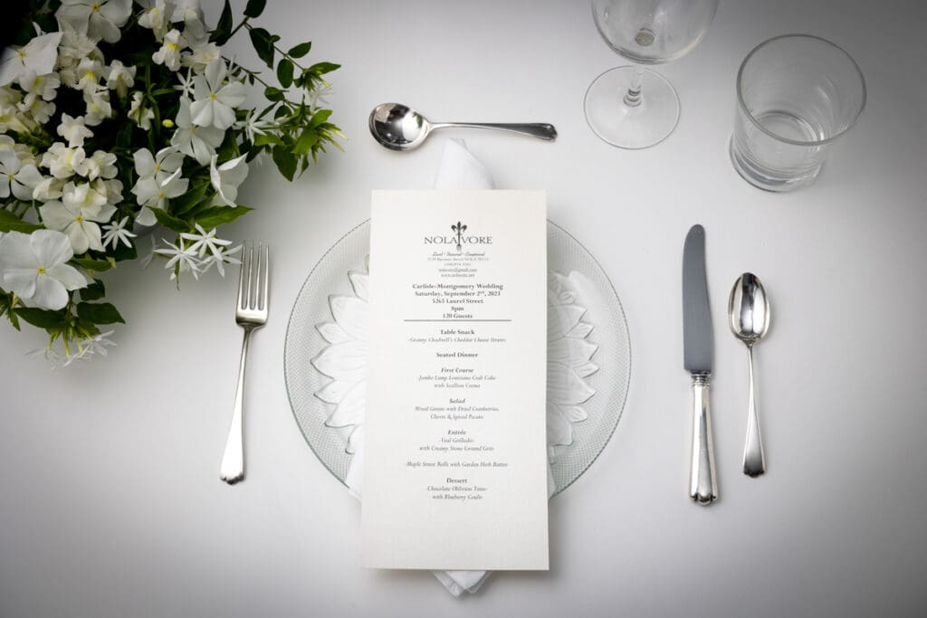Table setting for a wedding with menu on plate