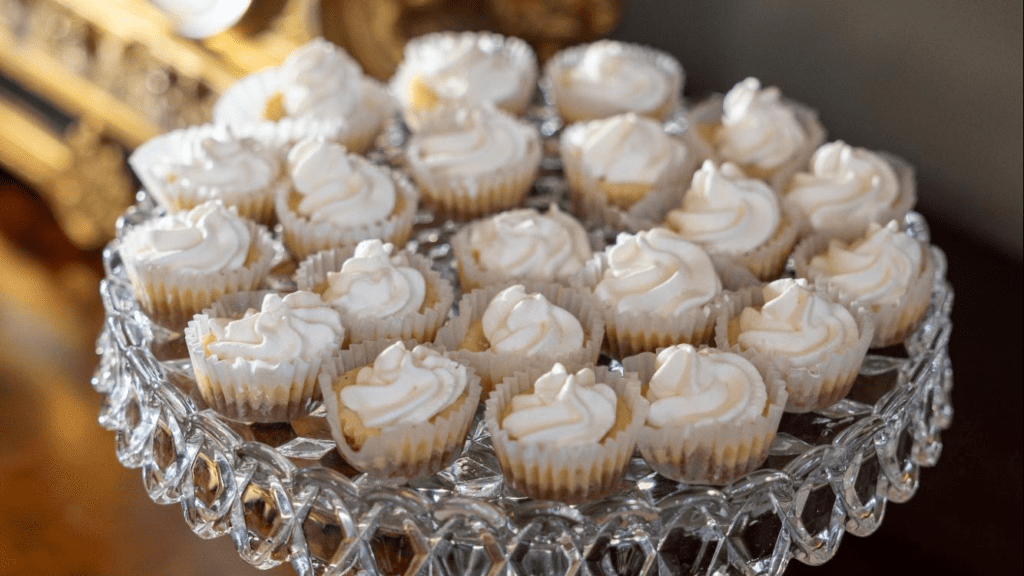 A platter full of small cupcake-like desserts
