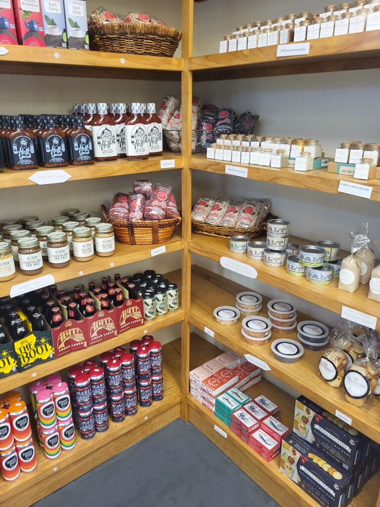 Shelves at Nolavore's A La Carte Market with various dry food goods