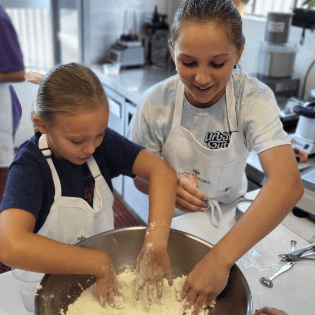 Nolavore campers mix dry ingredients in large bowl